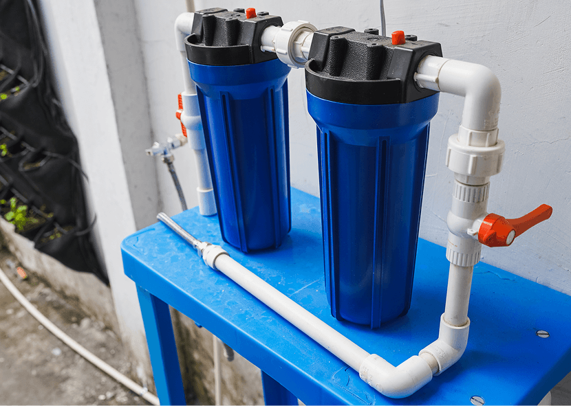 Dual water filters on a blue stand