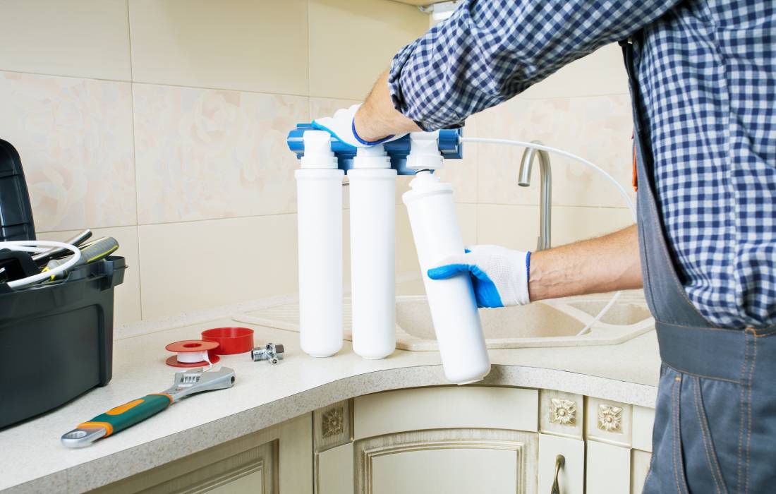 Technician working on water purification system