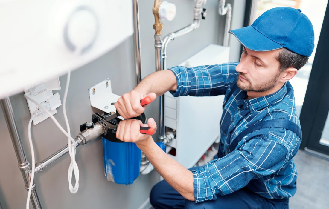 Man repairing plumbing equipment